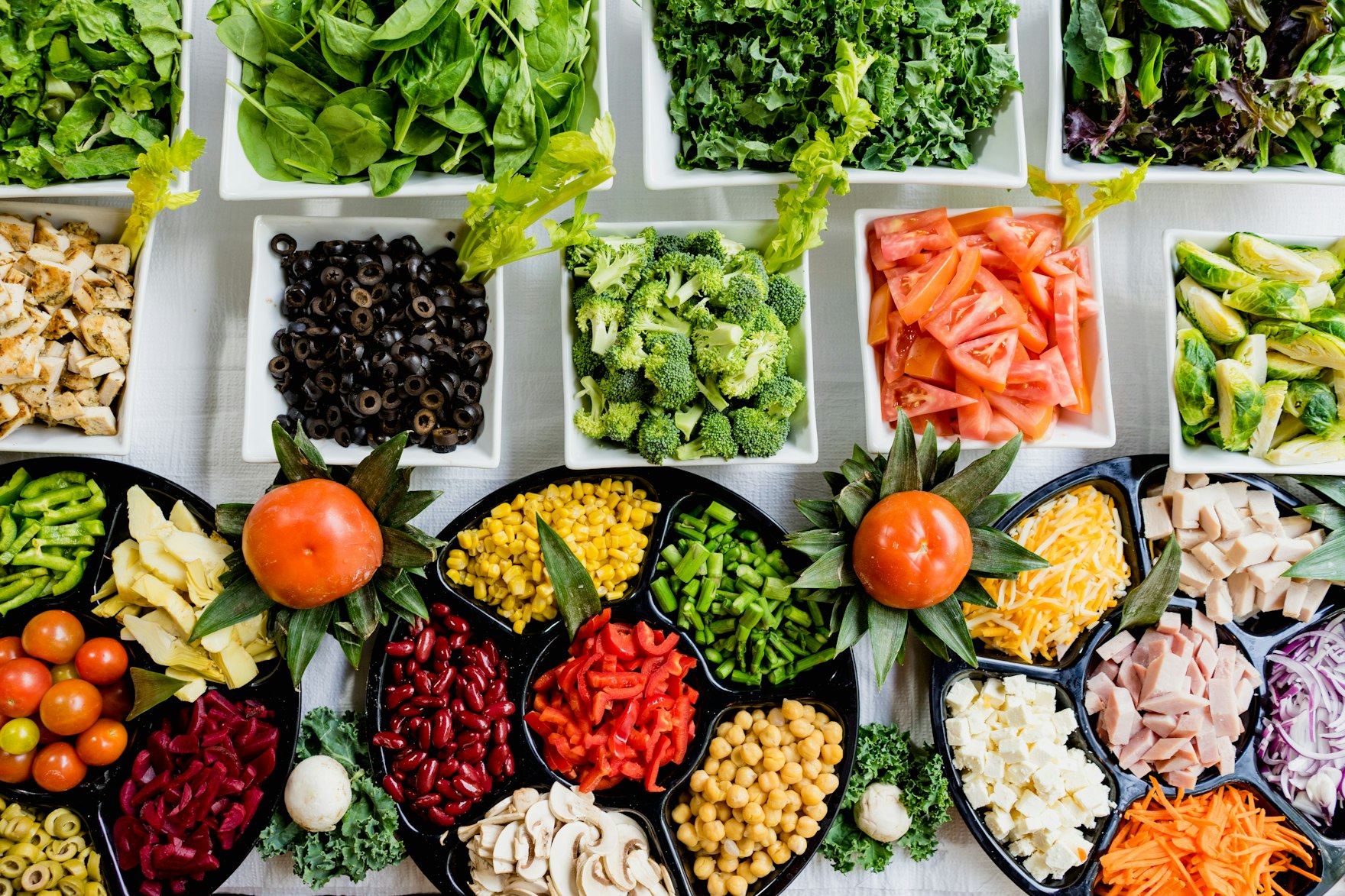 Sectioned deli trays filled with fresh food